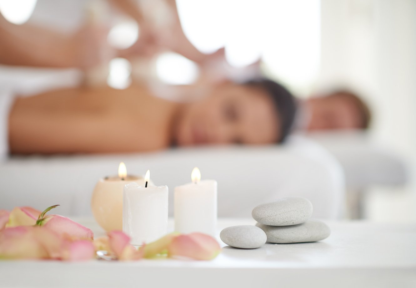 Blissful relaxation. A married couple receiving massages at